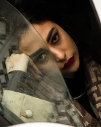 Close-up portrait of young woman wearing sunglasses