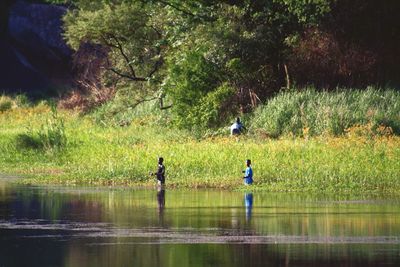 People standing in lake