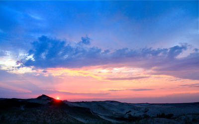 Scenic view of mountains against sky during sunset