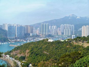 Modern buildings in city against sky