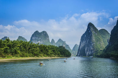 Panoramic view of boats in lake against sky