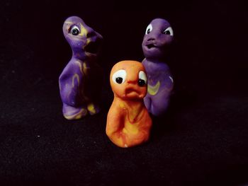 Close-up of stuffed toy against black background