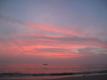 Scenic view of sea against orange sky