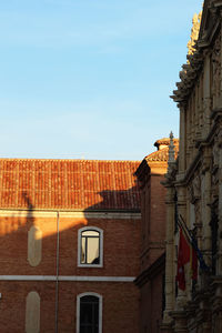 Low angle view of buildings against clear sky