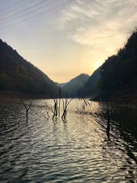 Scenic view of lake against sky during sunset