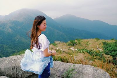 Woman standing on mountain landscape