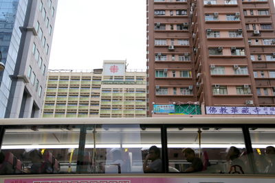 Low angle view of buildings in city against sky