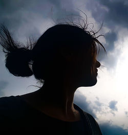 Low angle view of woman against clear sky