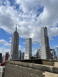 Low angle view of skyscrapers against sky