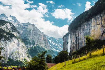 Lauterbrunnen valley, switzerland. swiss alps. village in mountains. waterfall and green meadows