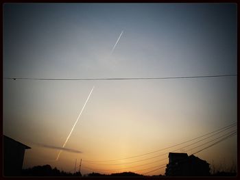 Low angle view of electricity pylon