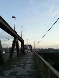 Empty road leading towards building