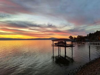 Autumn colors in the sky against the lake waters.