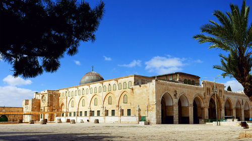 Historic buildings against blue sky