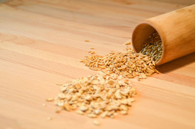 Close-up of whole wheat grains on table