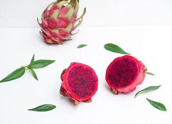 Close-up of strawberries on table against white background