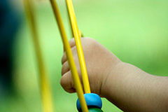 Close-up of hand holding yellow leaf