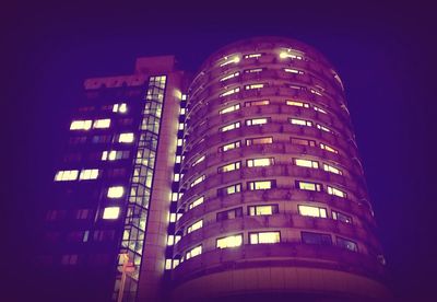 Low angle view of modern building at night