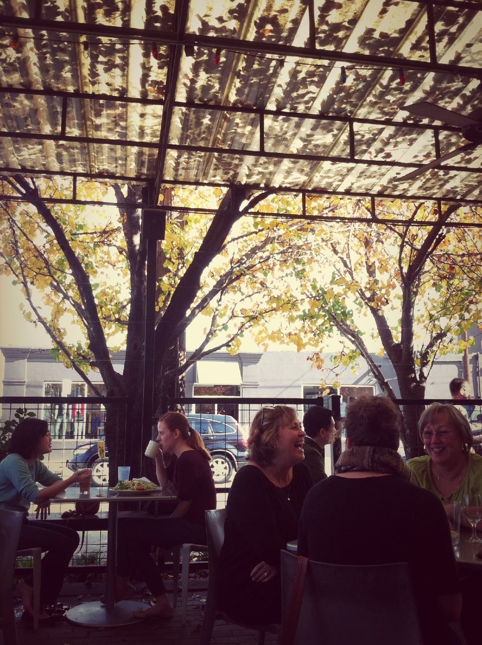 indoors, lifestyles, person, men, large group of people, leisure activity, table, restaurant, chair, sitting, medium group of people, glass - material, retail, window, ceiling, day, shopping, architecture, cafe