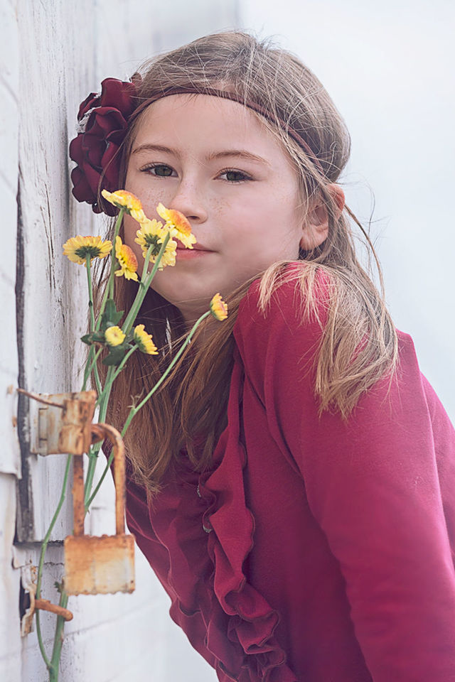 Child with daisies