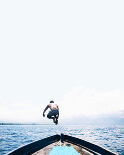 Full length of man diving into water