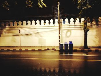 View of illuminated street lights at night