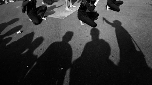 Shadow of people on tiled floor