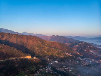 Scenic view of mountains against clear sky during sunset