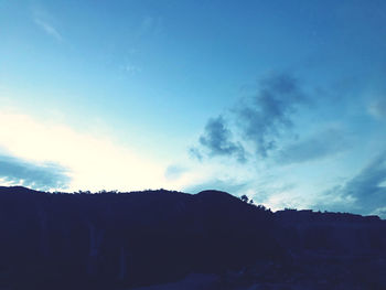 Low angle view of rock formation against sky