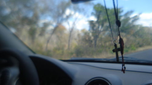 Close-up of car against sky