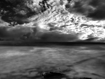 Scenic view of sea against cloudy sky