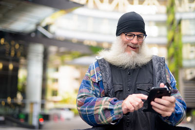 Portrait of man using mobile phone