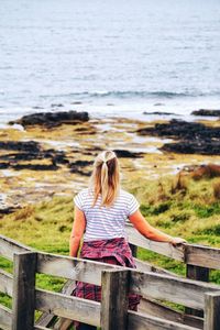 Rear view of woman looking at sea