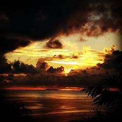 Scenic view of sea against cloudy sky