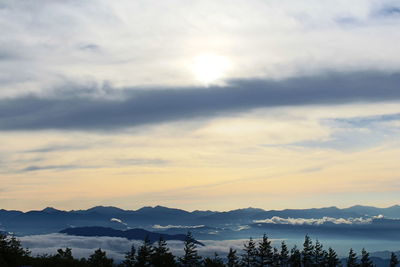 Scenic view of silhouette mountains against sky at sunset