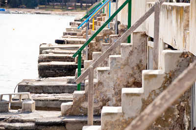 Row of metal railing and staircase at sportboat harbour