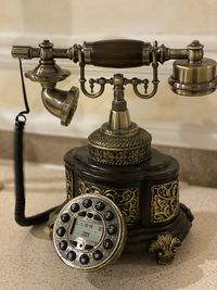 Close-up of old electric lamp on table