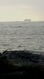 Scenic view of sea against clear sky during sunset