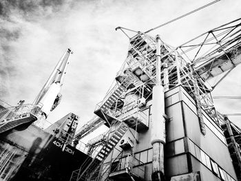 Low angle view of construction site against sky