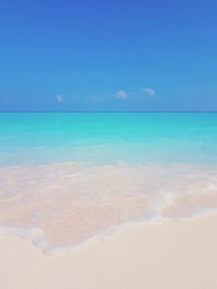 Scenic view of sea against blue sky