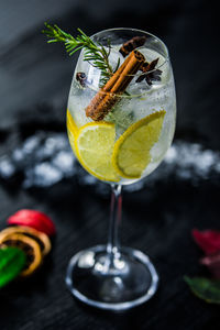 Close-up of drink on table against black background