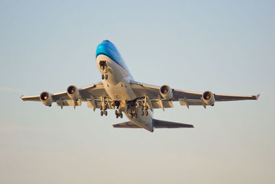 Low angle view of airplane against clear sky