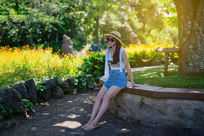 Portrait of woman sitting in garden