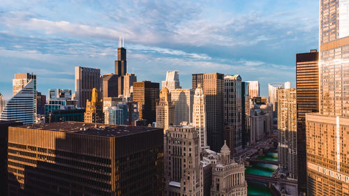 Modern buildings in city against sky
