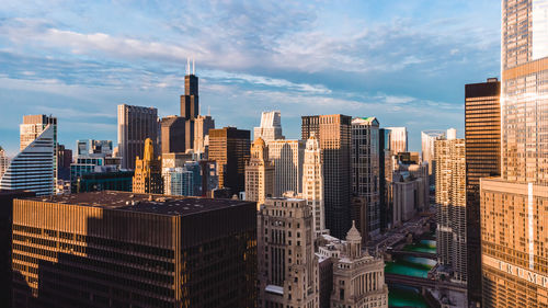 Modern buildings in city against sky