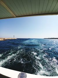 Scenic view of sea against clear blue sky