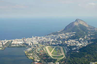 High angle view of city by sea