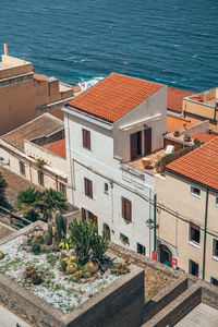 High angle view of townscape by sea