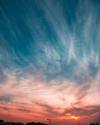Low angle view of dramatic sky during sunset