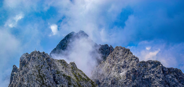 Low angle view of rocks against sky